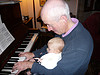 Baby and Grandpa at piano photograph.